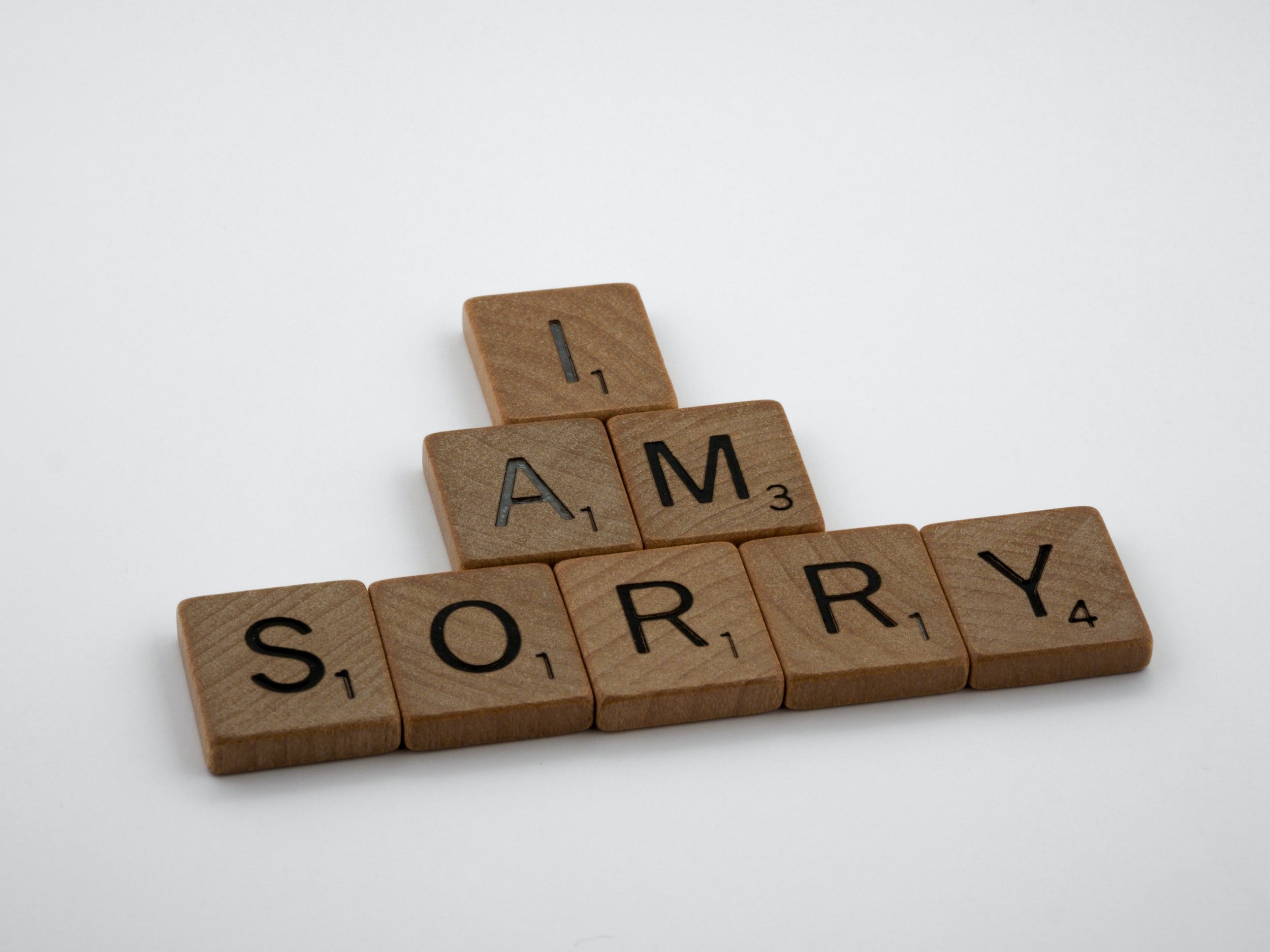 Wooden Letter Tiles Spell "I Am Sorry."