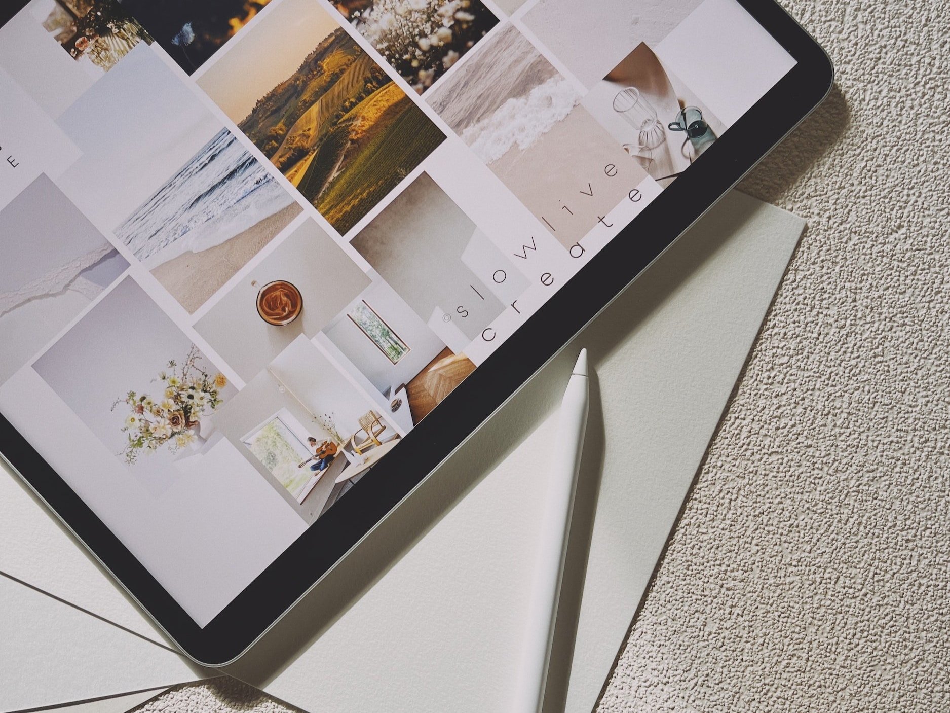 On an iPad, a mood board is displayed, with an Apple pencil to the side.