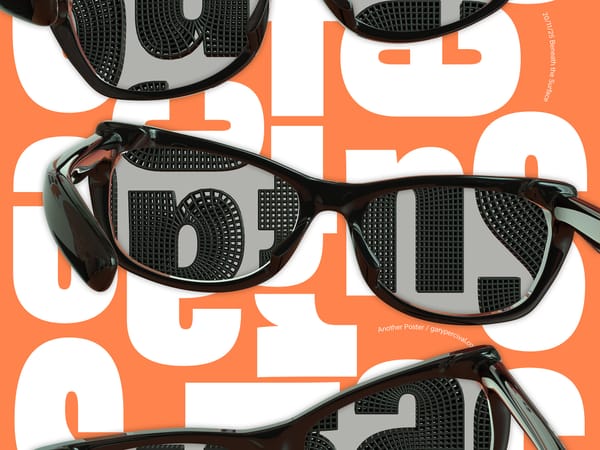 Black wraparound glasses reflecting bold grey letterforms over an orange and white typographic poster.