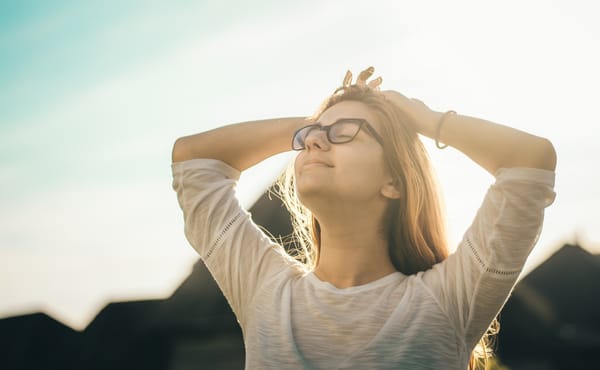 Woman peacefully relaxed, dispelling the myth that calm means not caring.